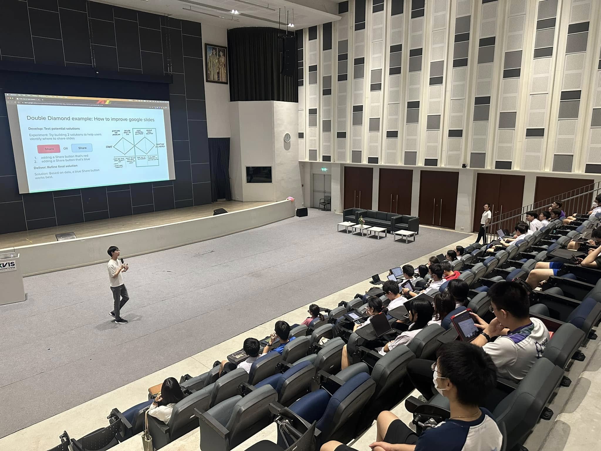 Addressing the full room of bootcamp students